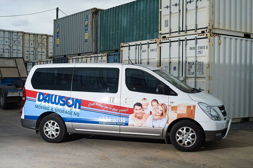 A White Van With A Picture Of A Family On The Side — Dawson Moving & Storage NQ in Brisbane, QLD