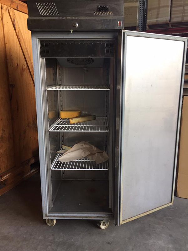A Stainless Steel Refrigerator With The Door Open And Shelves — Dawson Moving & Storage NQ in Sydney, NSW