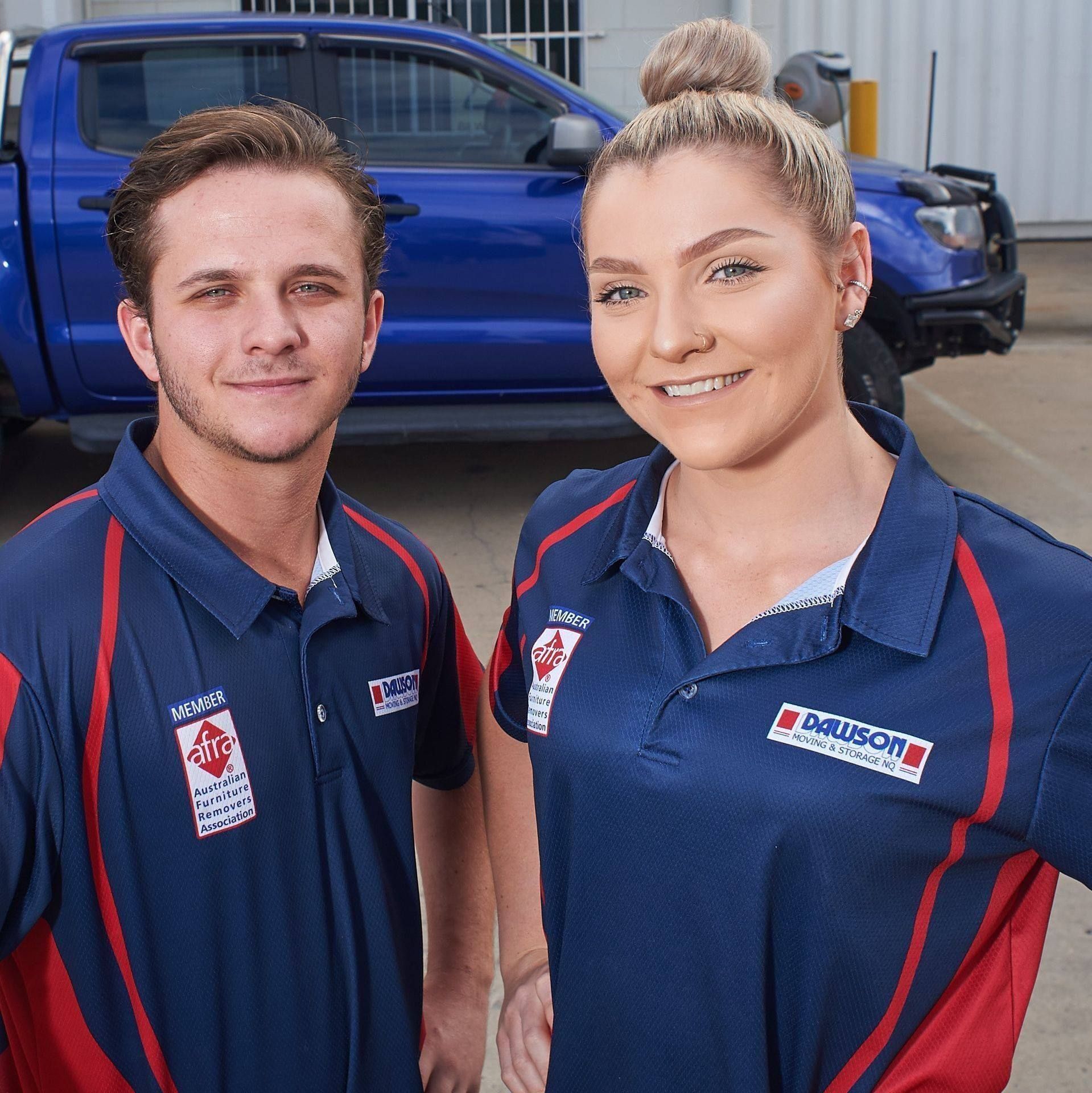 A Truck Is Parked In Front Of A Brick Building — Dawson Moving & Storage NQ in Mount St John, QLD