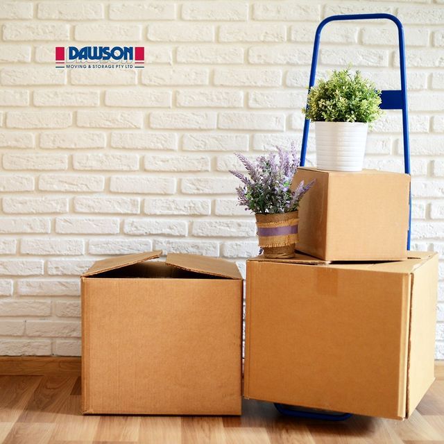 Three Cardboard Boxes Have Been Stacked Into A Column — Dawson Moving & Storage NQ in Brisbane, QLD