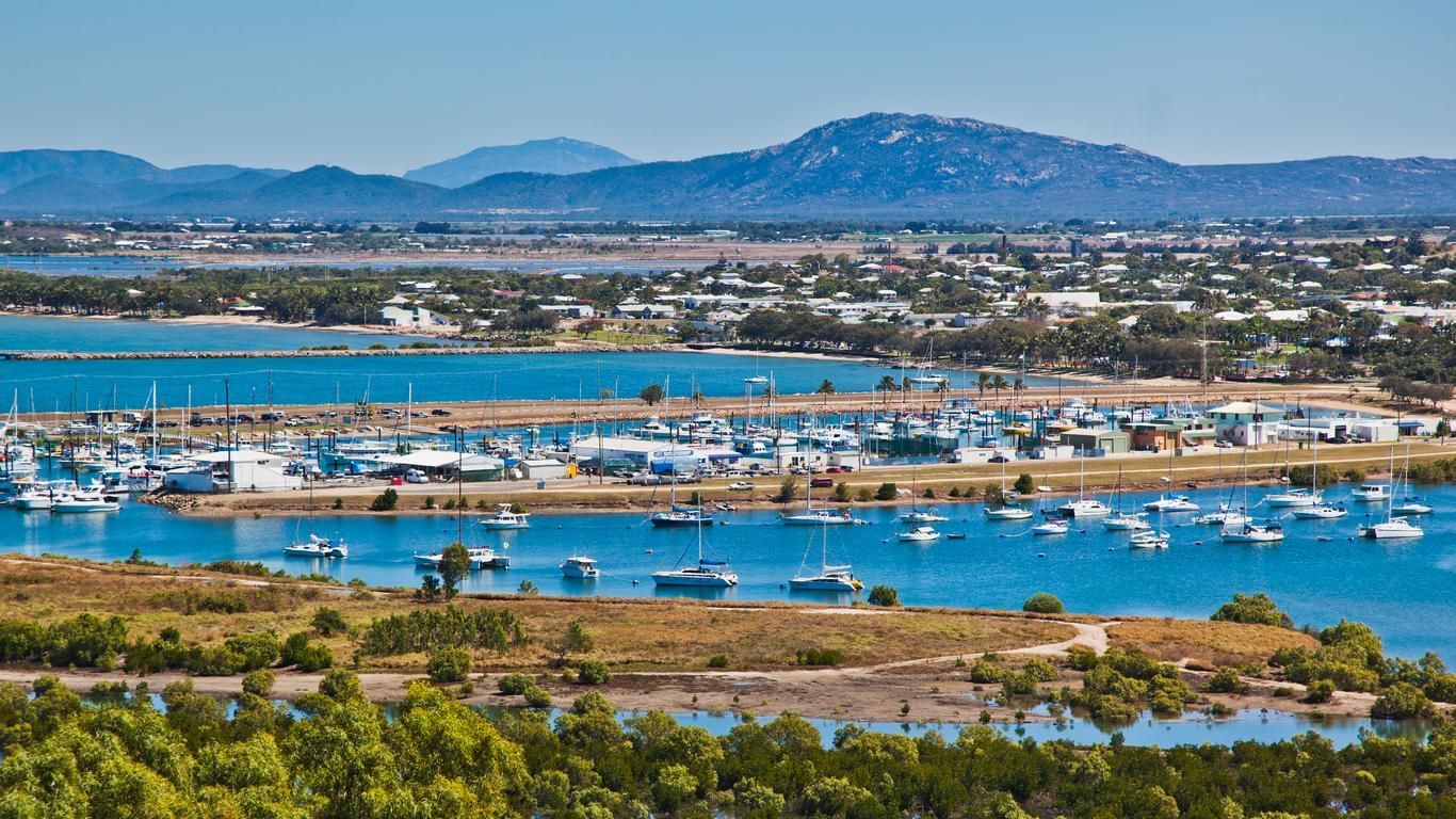 Boats On The Water With A Mountain In The Background — Dawson Moving & Storage NQ in Bowen, QLD