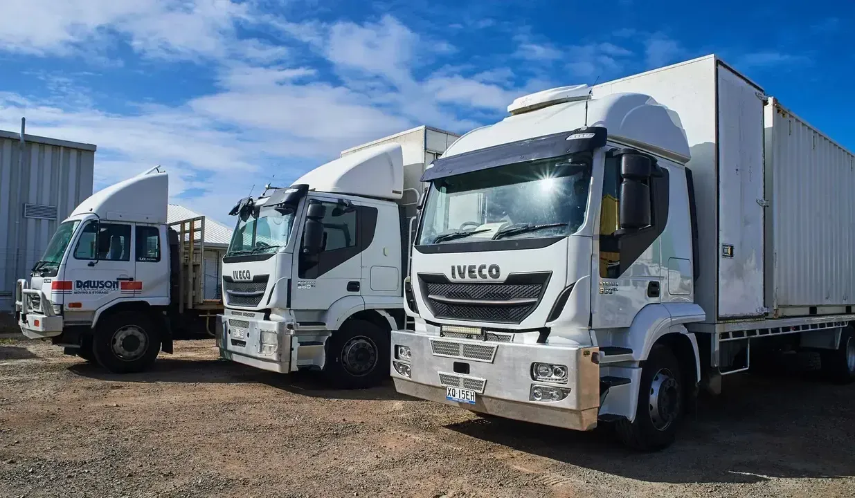 A Dawson Moving And Storage Truck Is Parked In Front Of A Building — Dawson Moving & Storage NQ in Mount St John, QLD