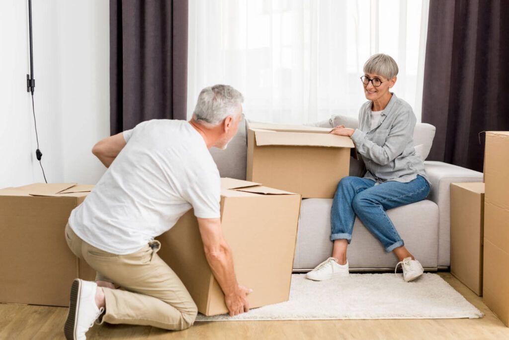 An Elderly Couple Is Moving Into A New Home — Dawson Moving & Storage NQ in Mount St John, QLD