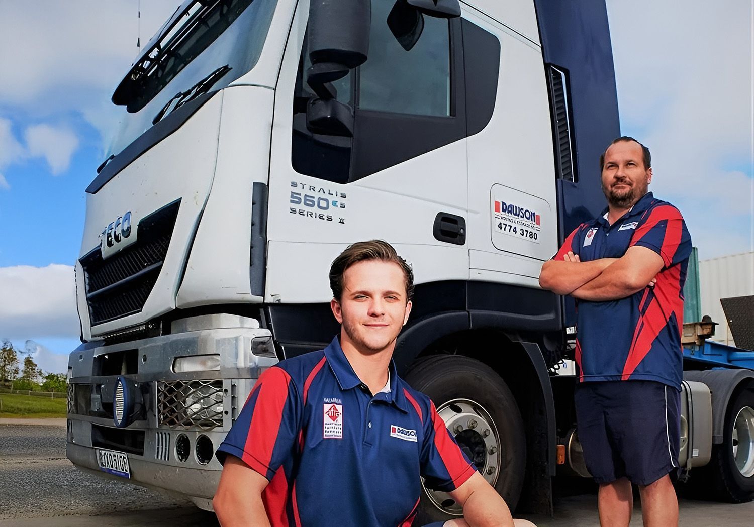 Two Men in Uniform in Front of a Truck