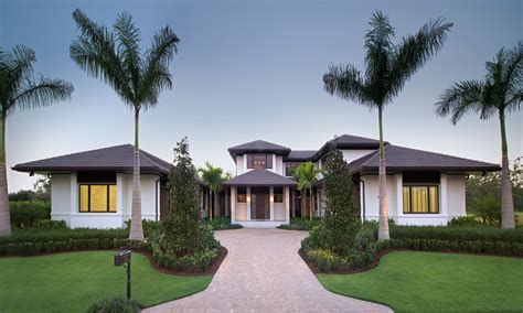 A large house with palm trees in front of it