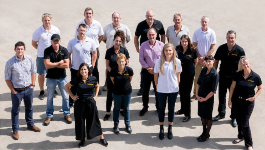 Group of people standing outdoors.