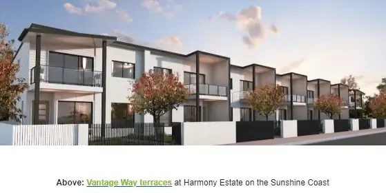 Row of modern townhouses on the Sunshine Coast with balconies and trees.