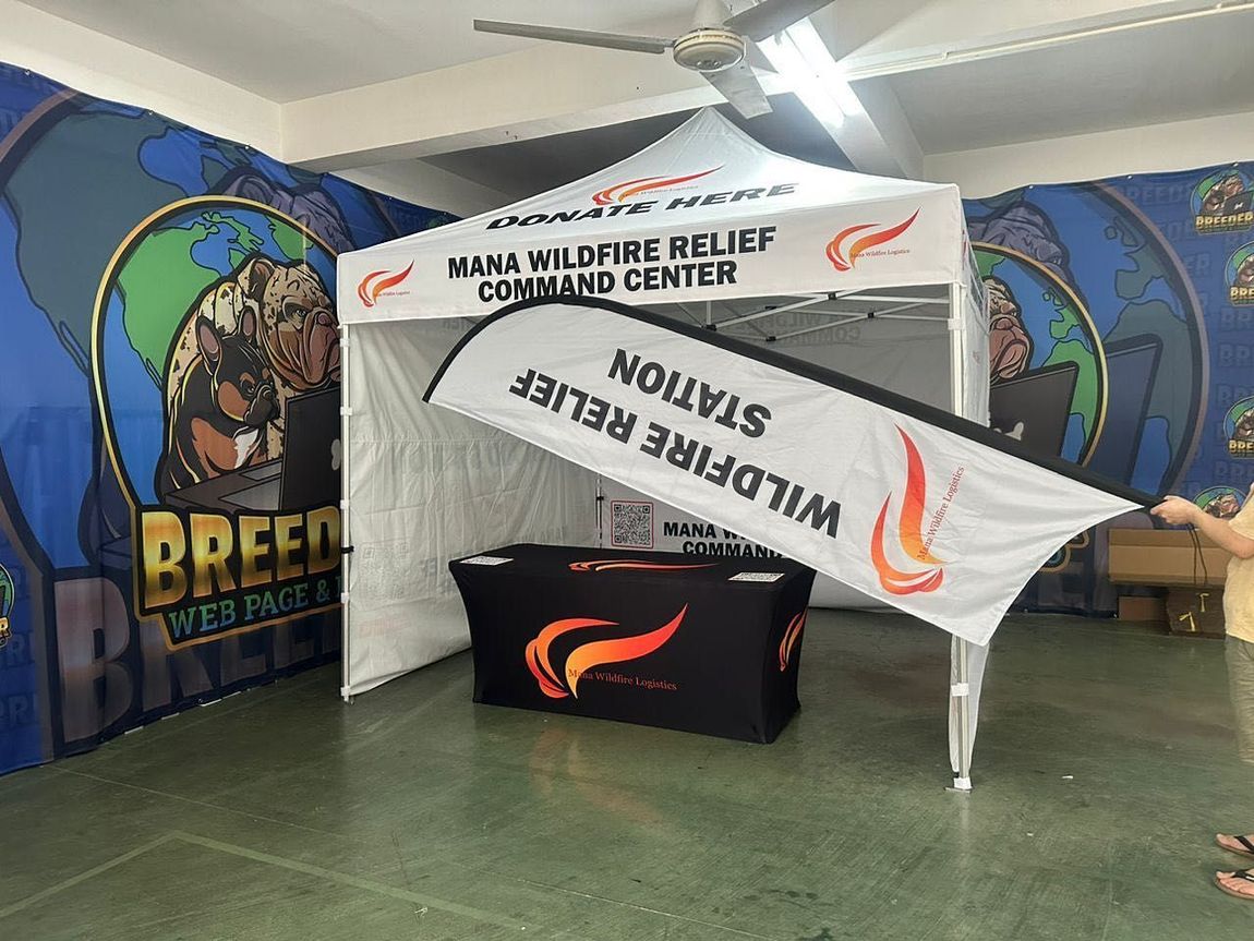 White River Relief Command Center banner on a table at an indoor event booth with wildlife-themed backdrops
