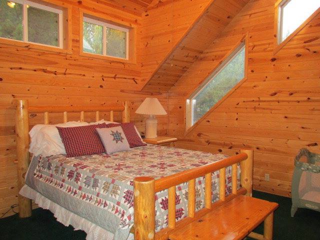 A bed with wooden frame