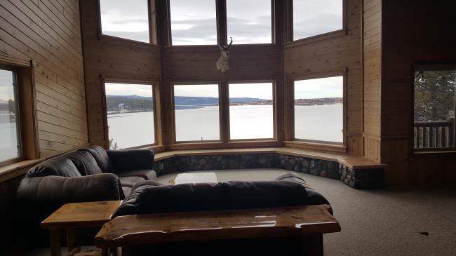 Living room with a beautiful view of a lake