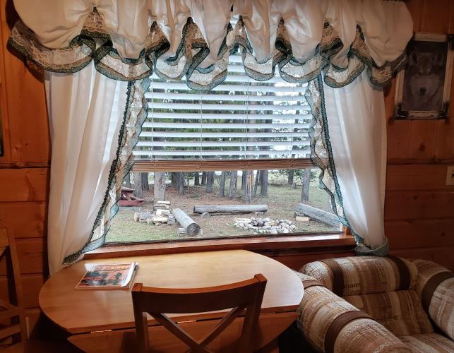 A window with blinds and curtain