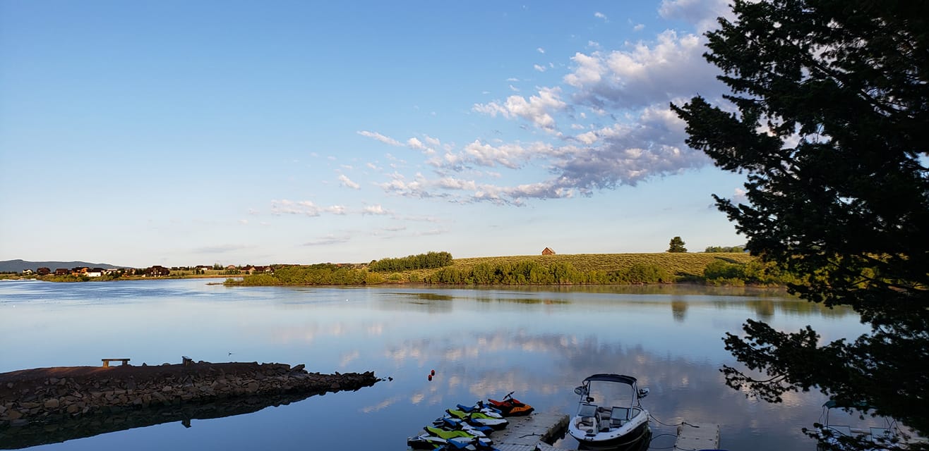 Jet skis and a boat on a dock