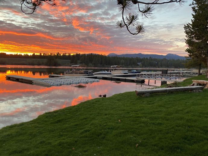 Sunset over dock on lake