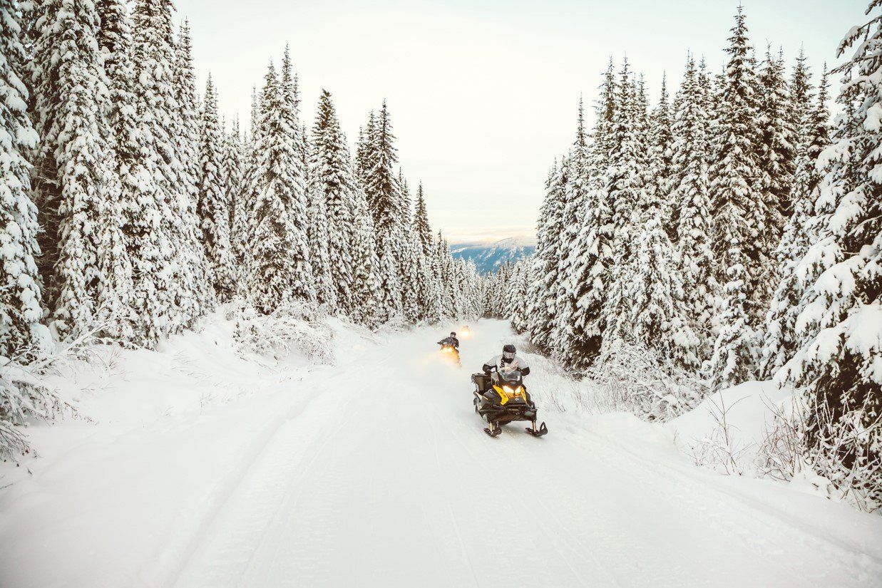 Snowmobile running on a snowy trail