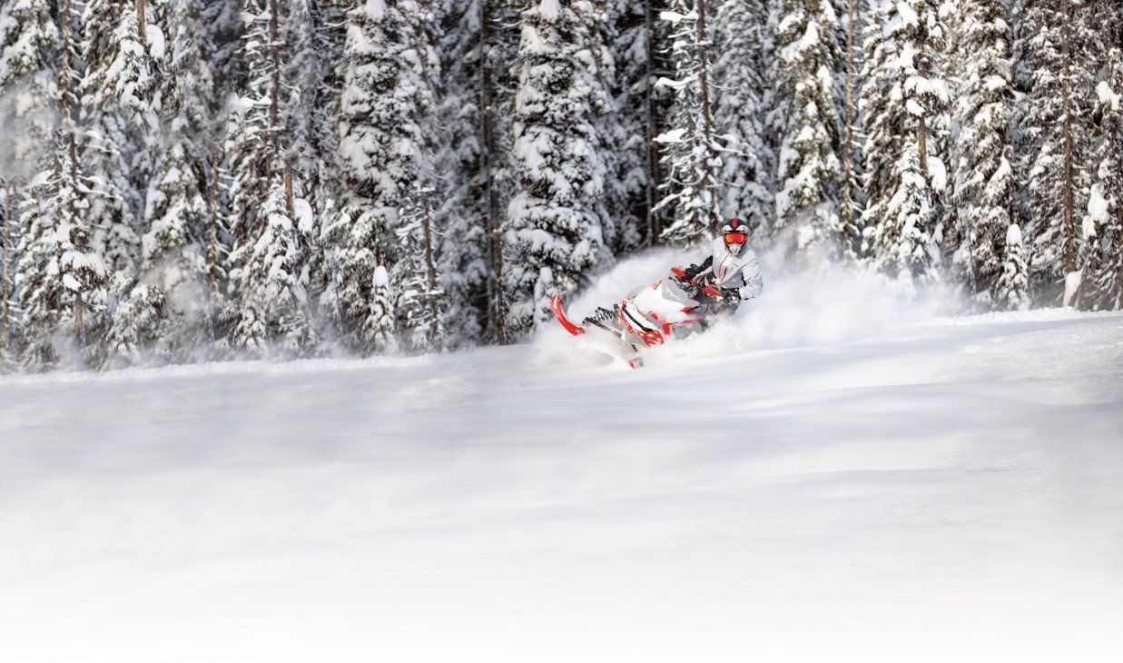 Snowmobile creating a snow smoke