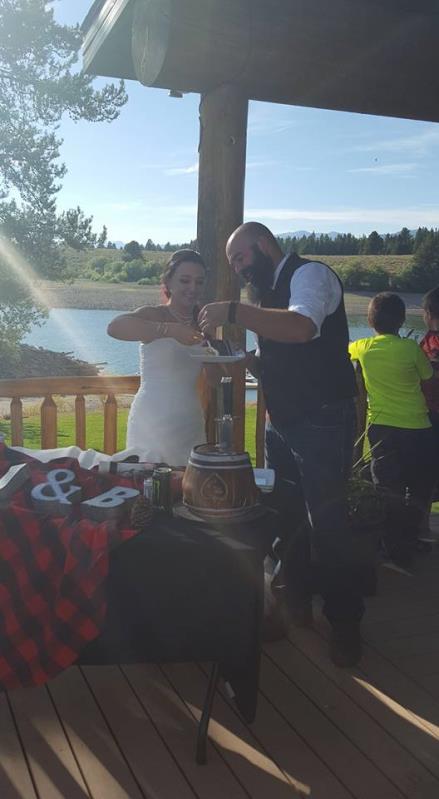 Couple slicing their cake