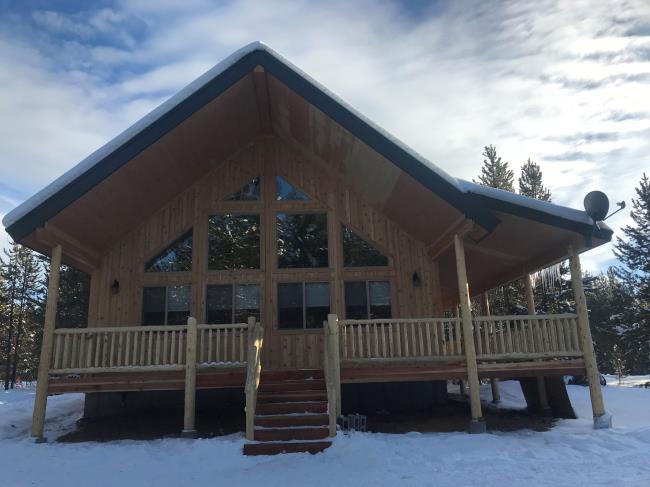 Front side of a cabin with glass windows
