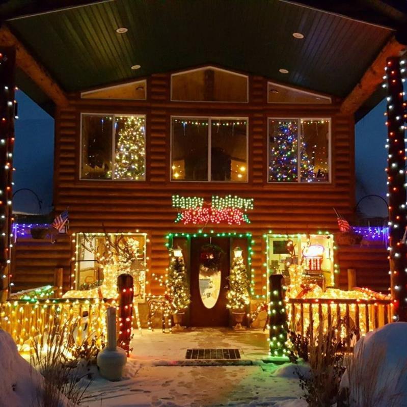A porch decorated by Christmas lights