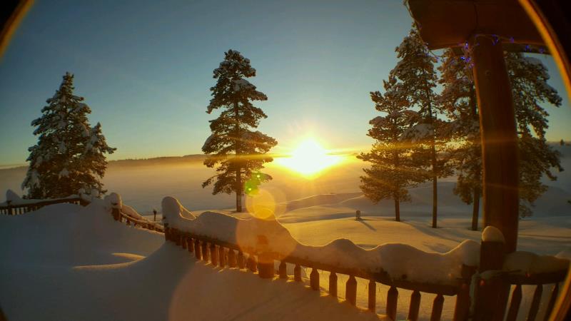 sunset of snowy lake and deck