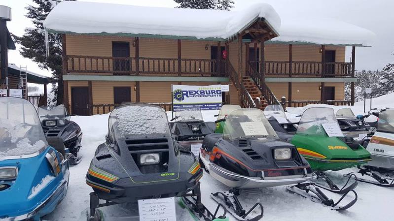 Snowmobiles parked outside a building