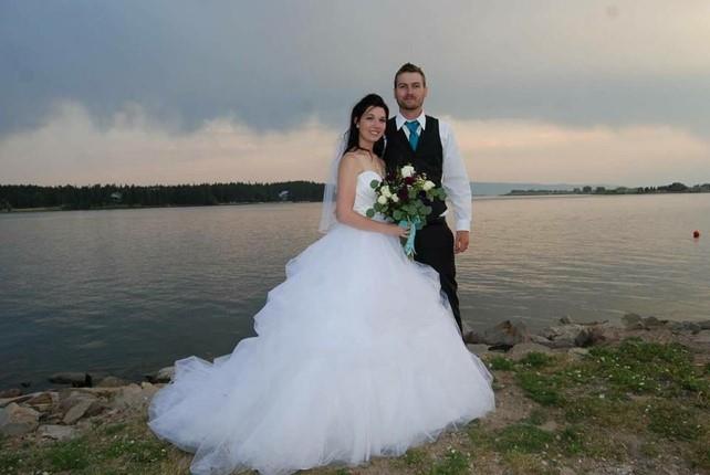Bride and groom posing for a photo