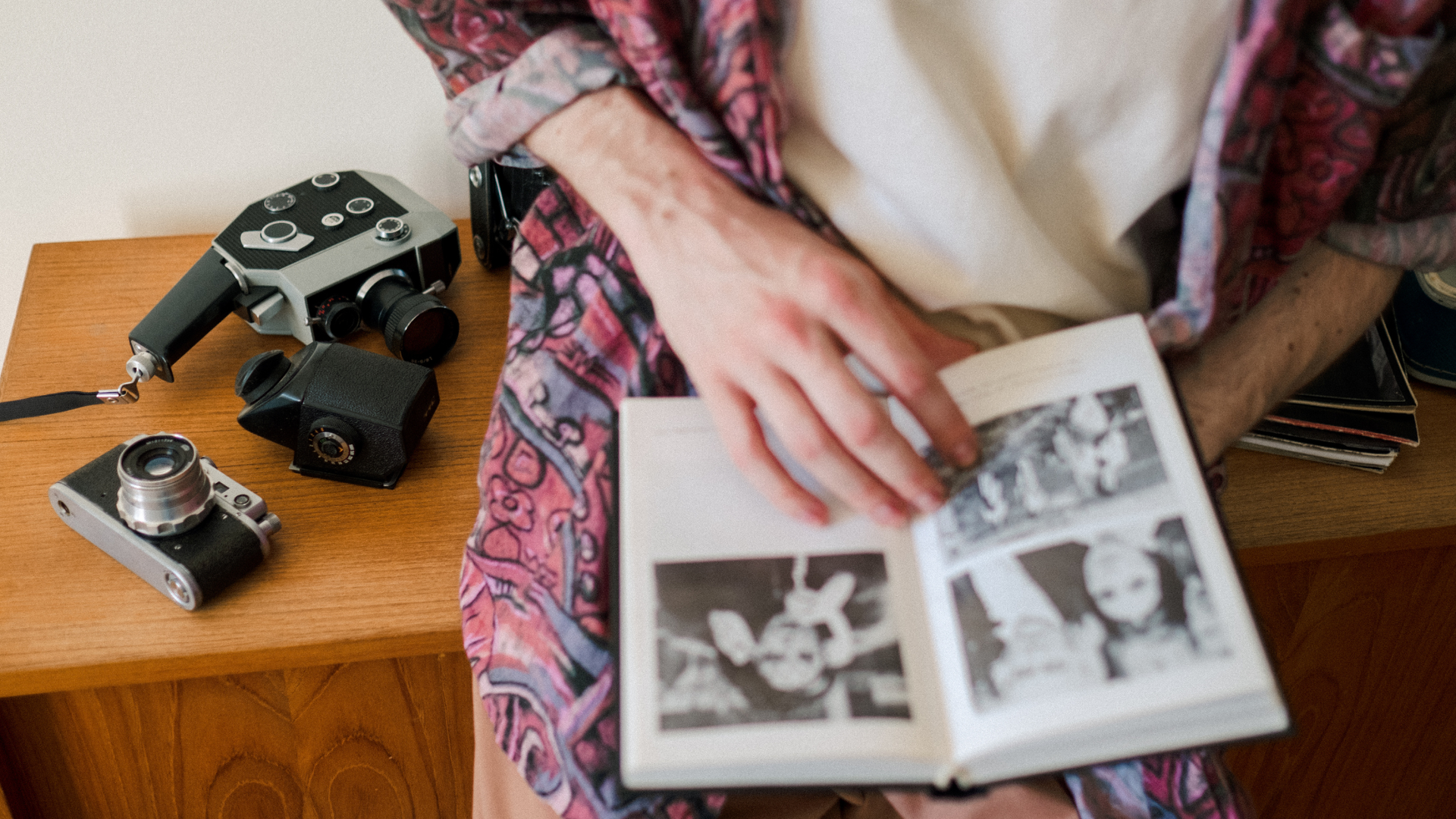 person looking through memory book of photos