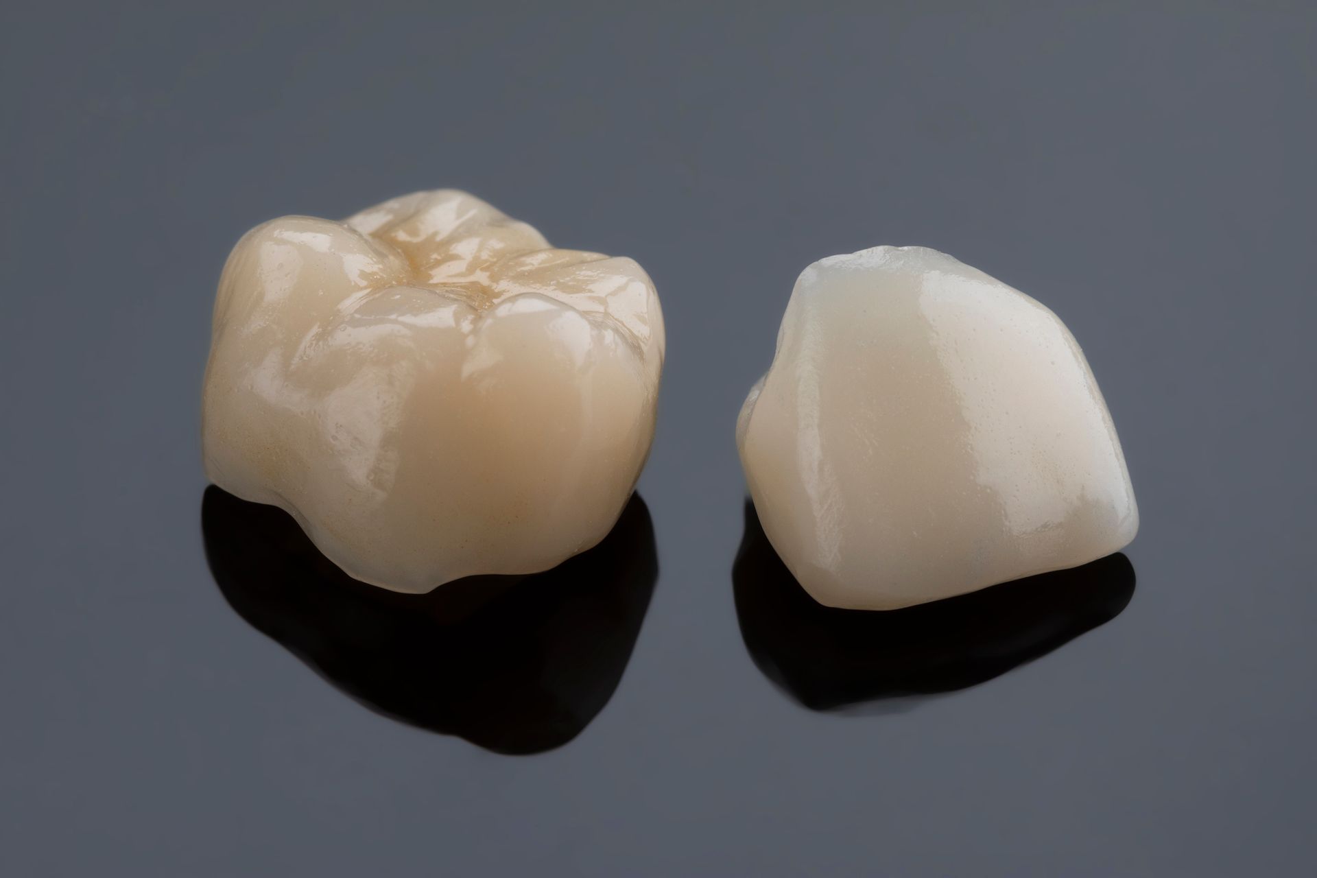 Dental ceramic crowns on the black background isolated