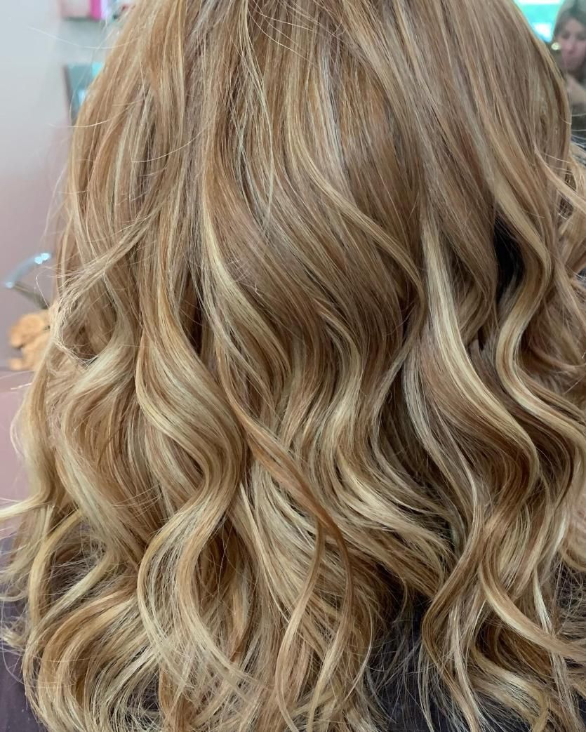 A Close Up of a Woman's Blonde Wavy Hair in a Salon — Hair By Jell In Airlie Beach, QLD