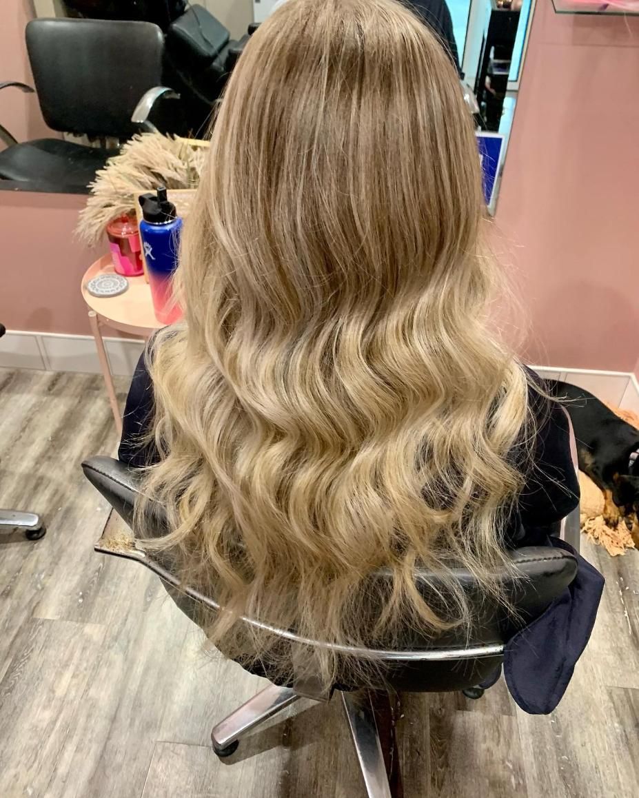 A Woman Is Sitting In A Chair With Her Hair In A Salon — Hair By Jell In Cannonvale, QLD