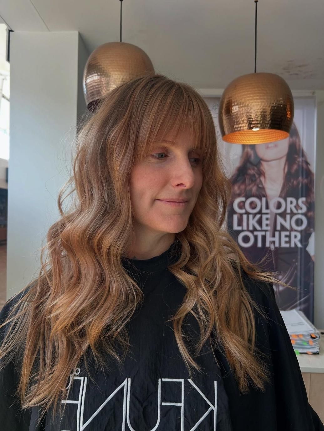 A Woman With Long Hair is Wearing a Black Shirt That Says Colors Like No Other — Hair By Jell In Airlie Beach, QLD
