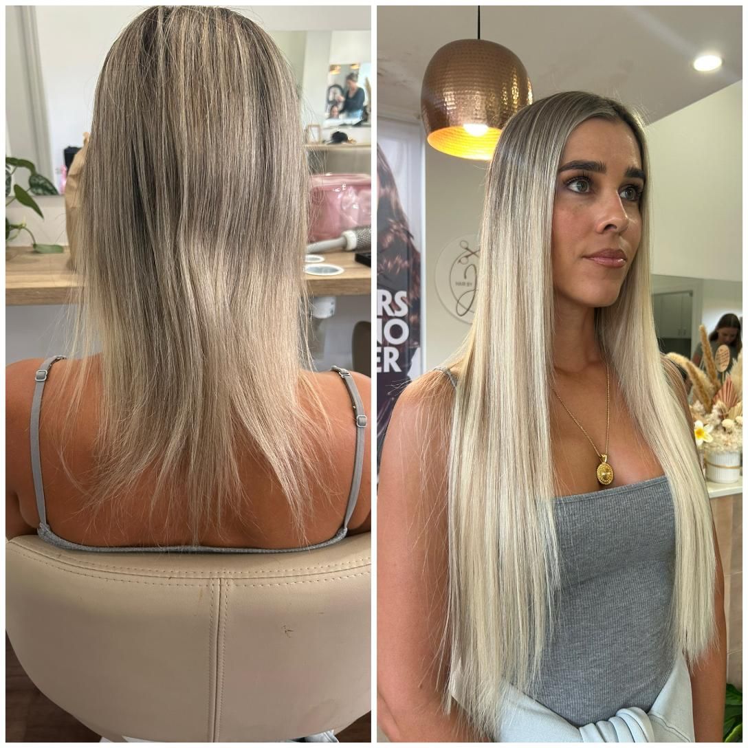 A Woman With Long Blonde Hair is Sitting in a Chair — Hair By Jell In Cannonvale, QLD