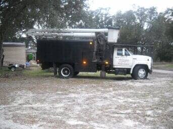 Tree experts truck in an open area — Truck in Lady Lake, FL