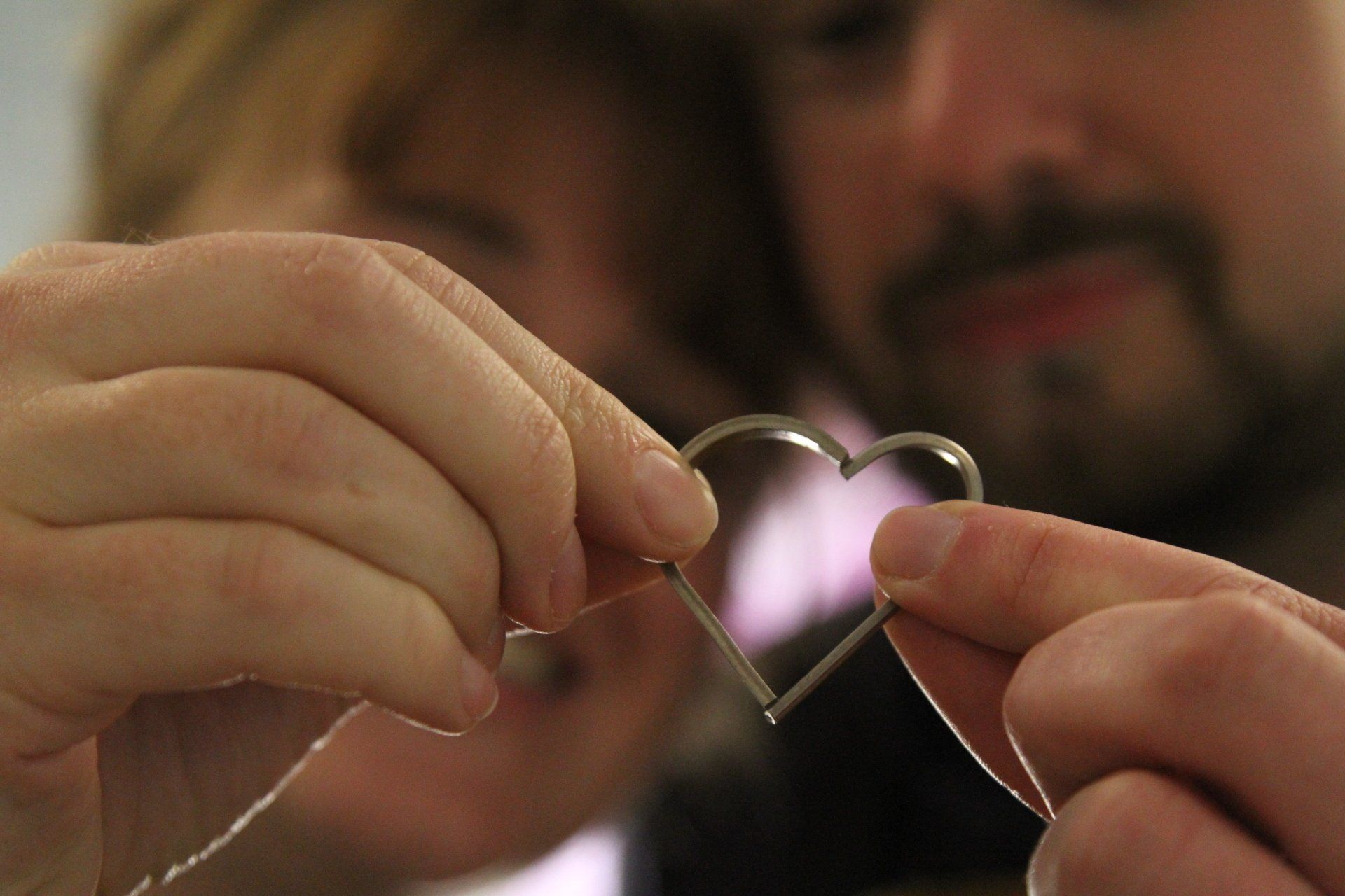 happy couple examining rings