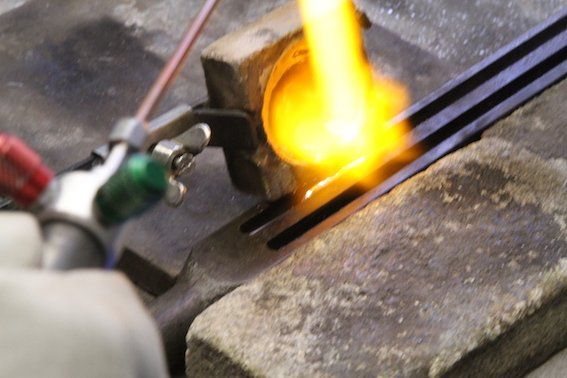 Pouring the gold to make an ingot