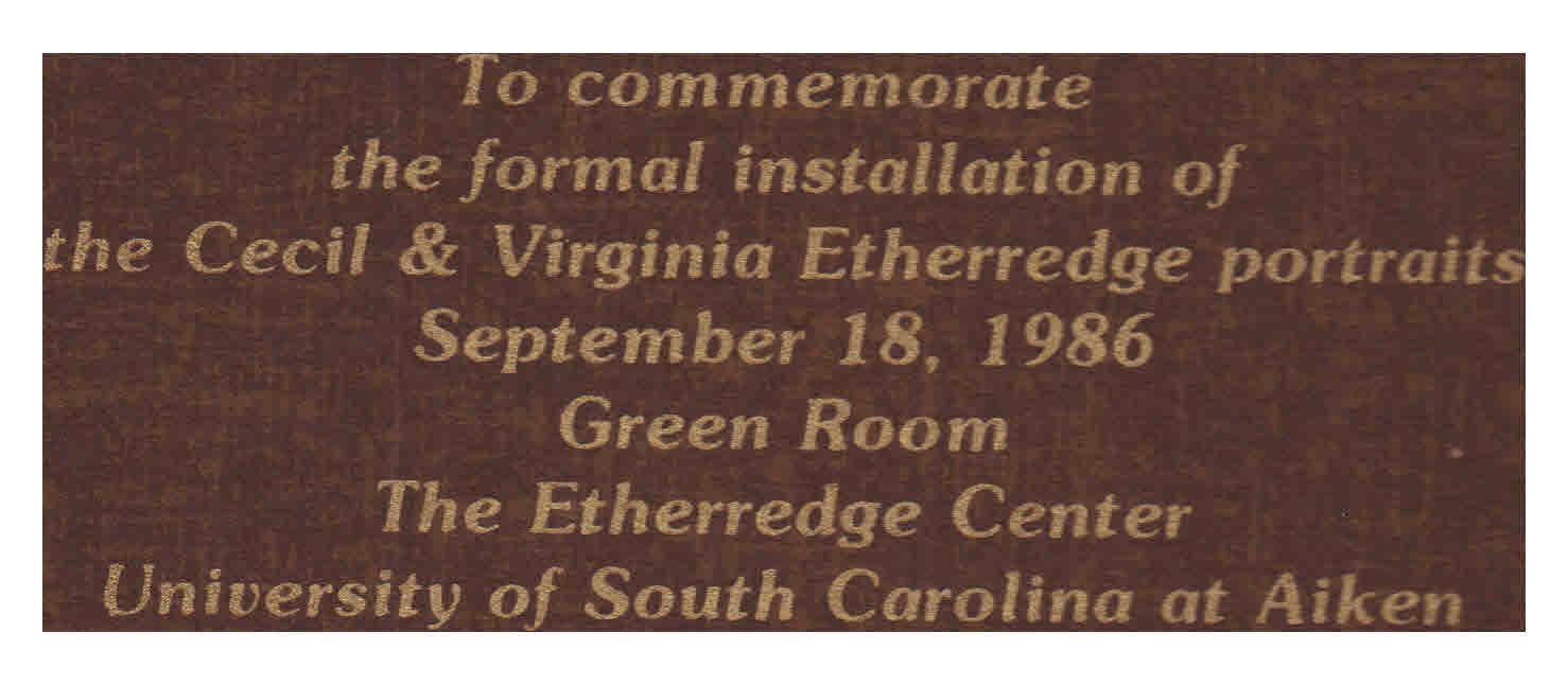 A brown sign that says to commemorate the formal installation of the cecil & virginia etheredge portraits september 18 1986