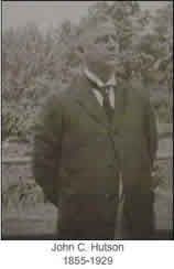 A black and white photo of a man in a suit and tie.