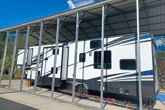 RV under metal carport