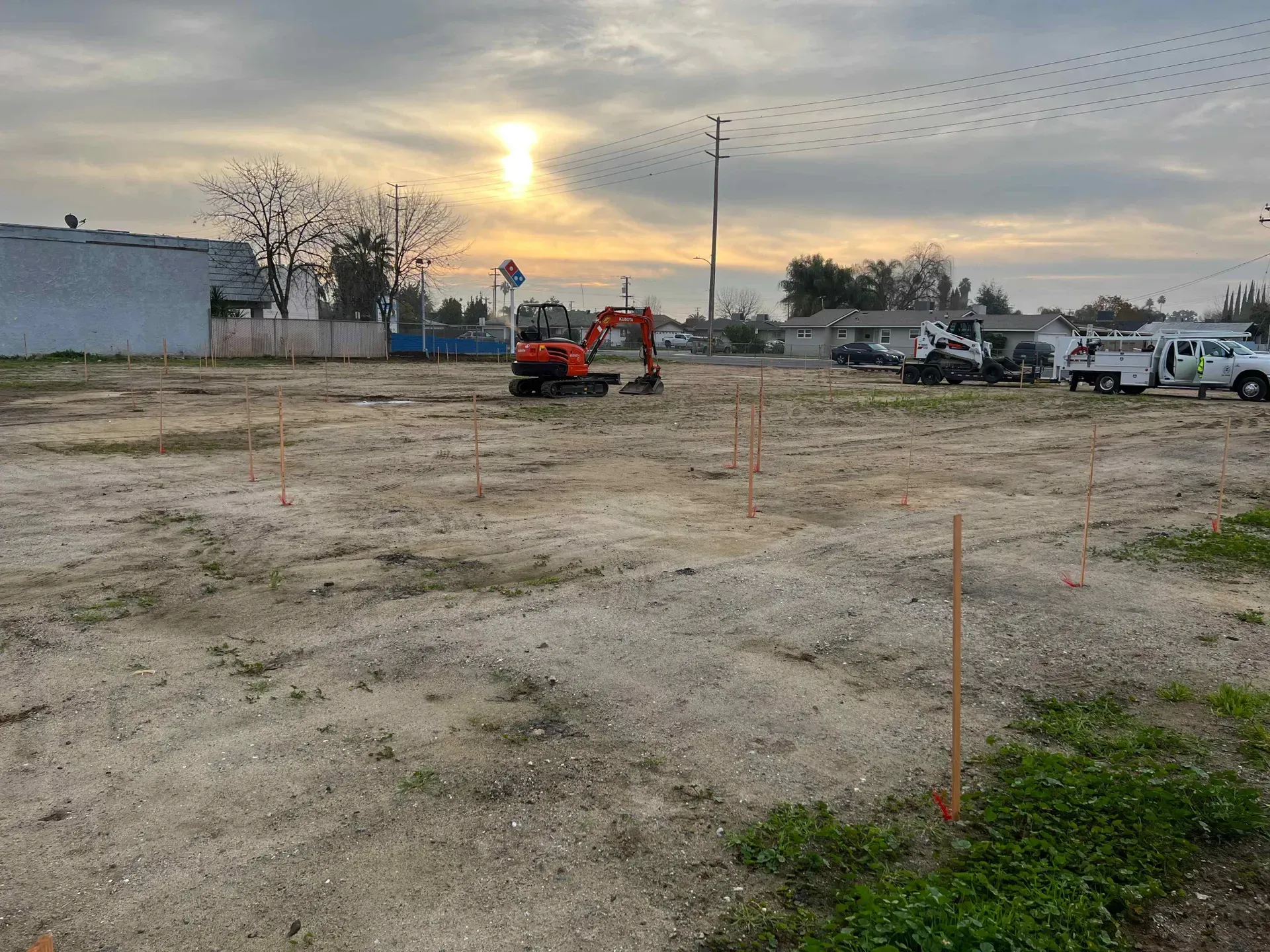 A construction site with a bulldozer in the middle of it.