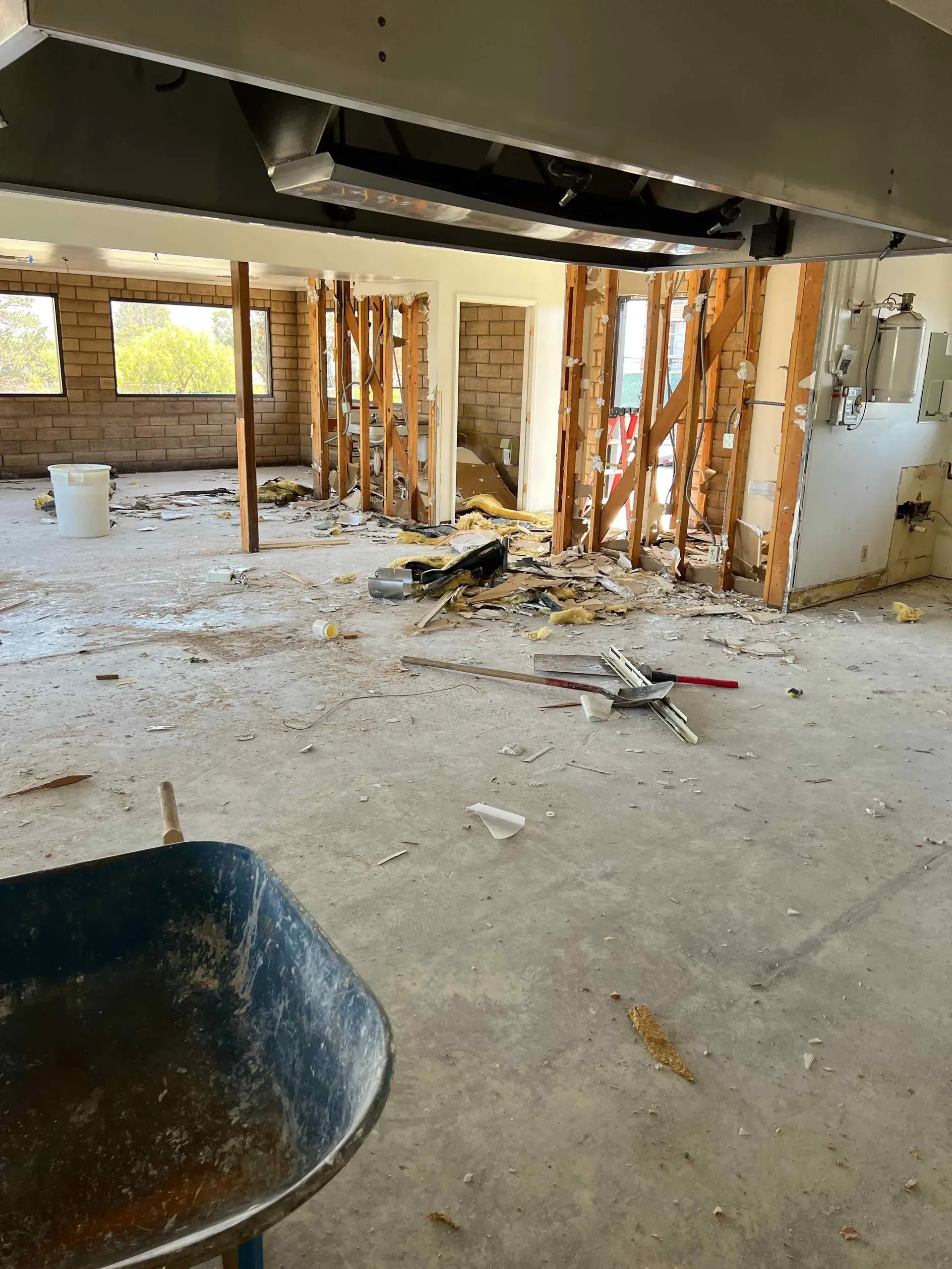 There is a wheelbarrow in the middle of the room.