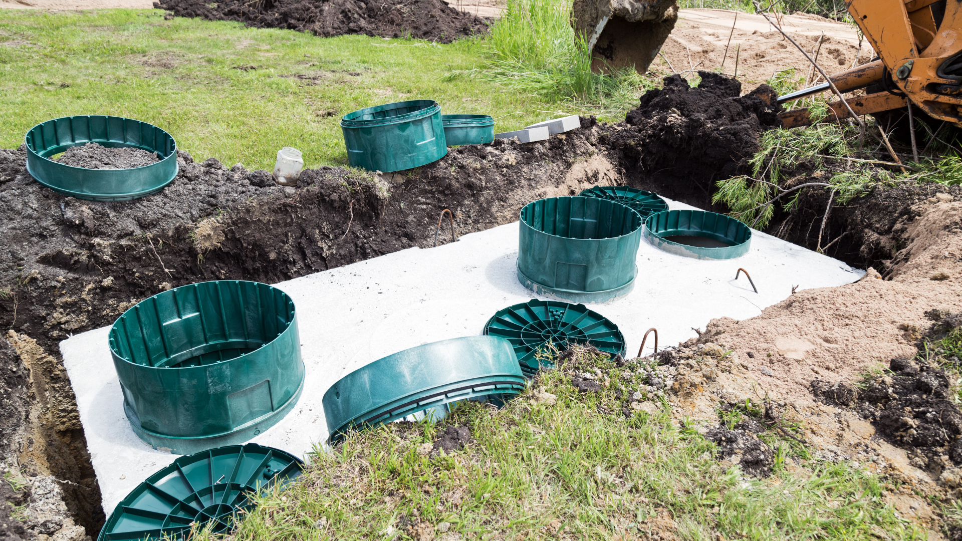 A septic tank is being installed in a yard.