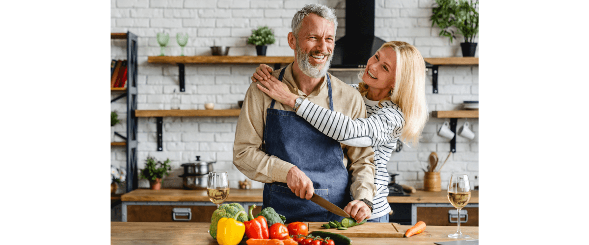 happy couple cooking