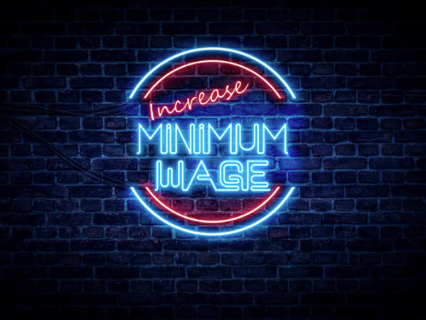 Neon Sign on Brick Wall Increase Minimum Wage — People Assured Partners in Cannonvale, QLD