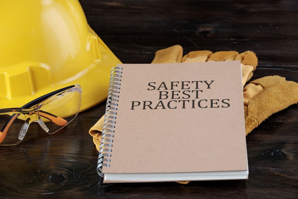 Yellow Hard Hat, Safety Glasses, Gloves, and a Notepad — People Assured Partners in Townsville, QLD