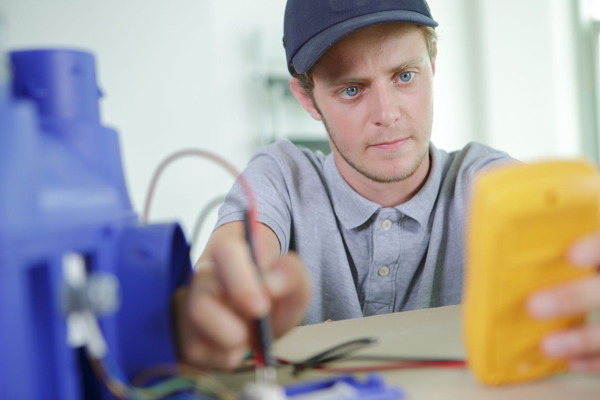 Man testing circuits highlighting residential electrical malfunction repair for safe home systems. Man testing circuits highlighting residential electrical malfunction repair for safe home systems.