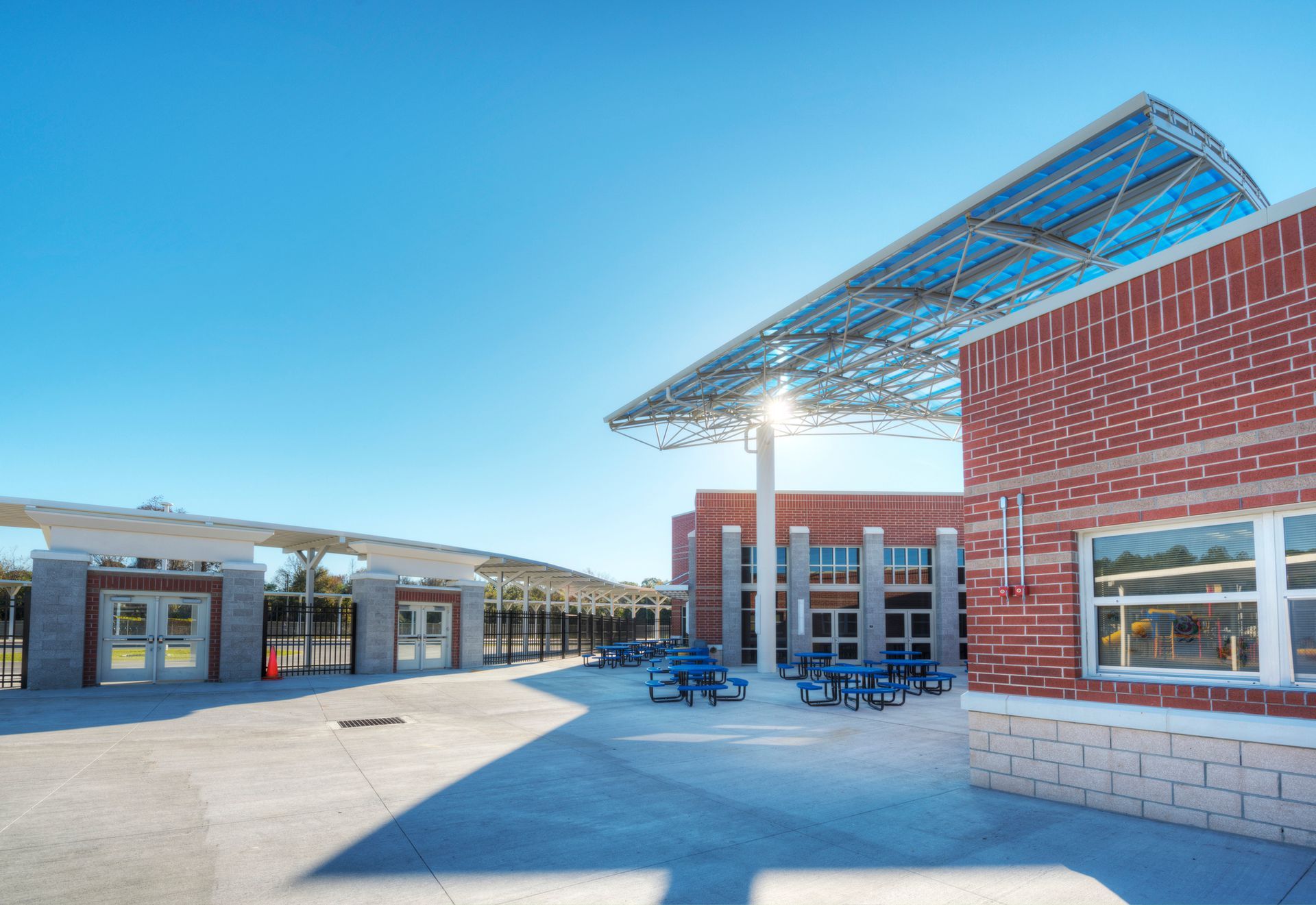A brick building with a solar panel on the roof.