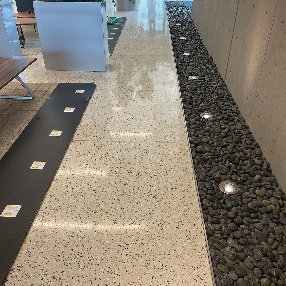 A hallway with a row of rocks in the middle