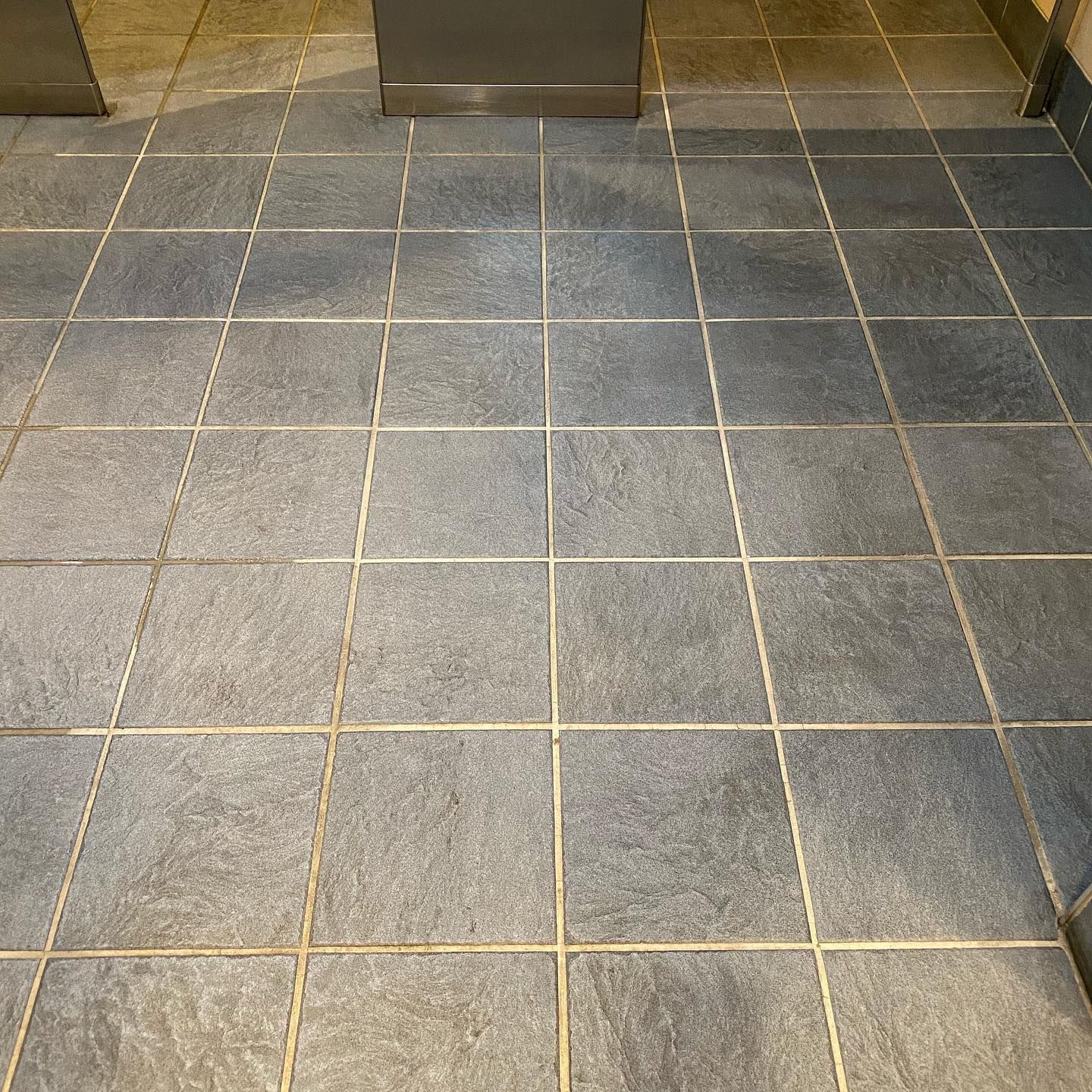 A close up of a tiled floor in a room.