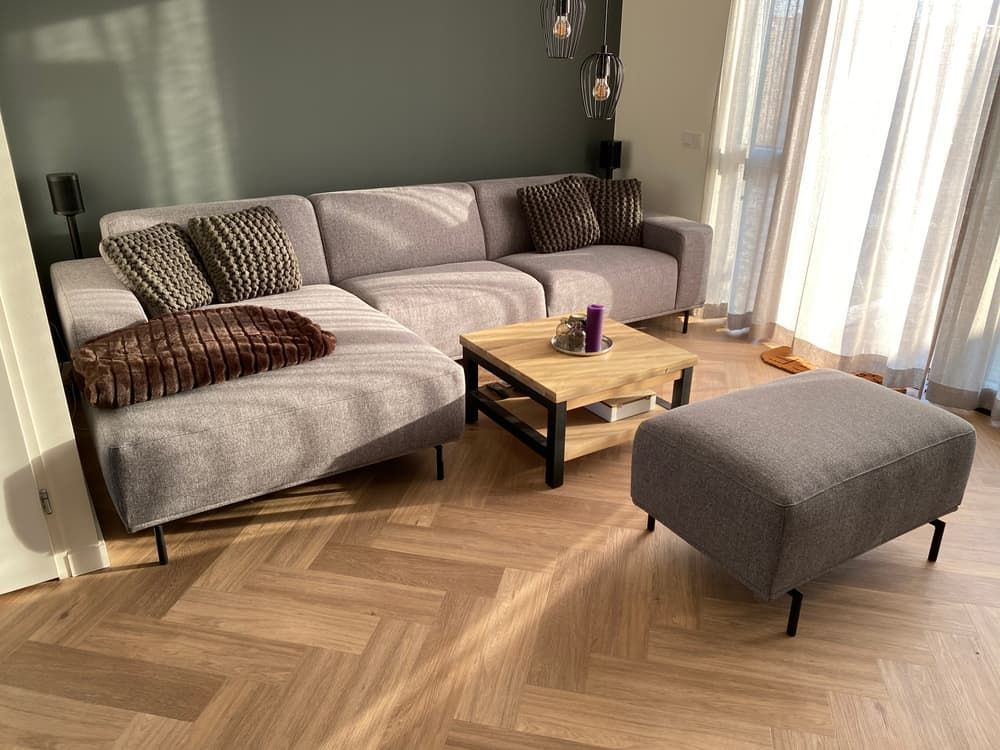 A Living Room With A Couch , Coffee Table And Ottoman — Norm Evans Floors Pty Ltd in Gympie, QLD