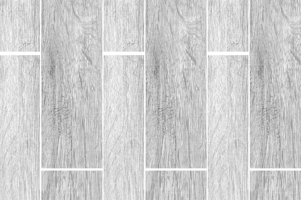 A Close Up Of A Gray Tile Floor With A Wood Grain Texture — Norm Evans Floors Pty Ltd in Caloundra, QLD