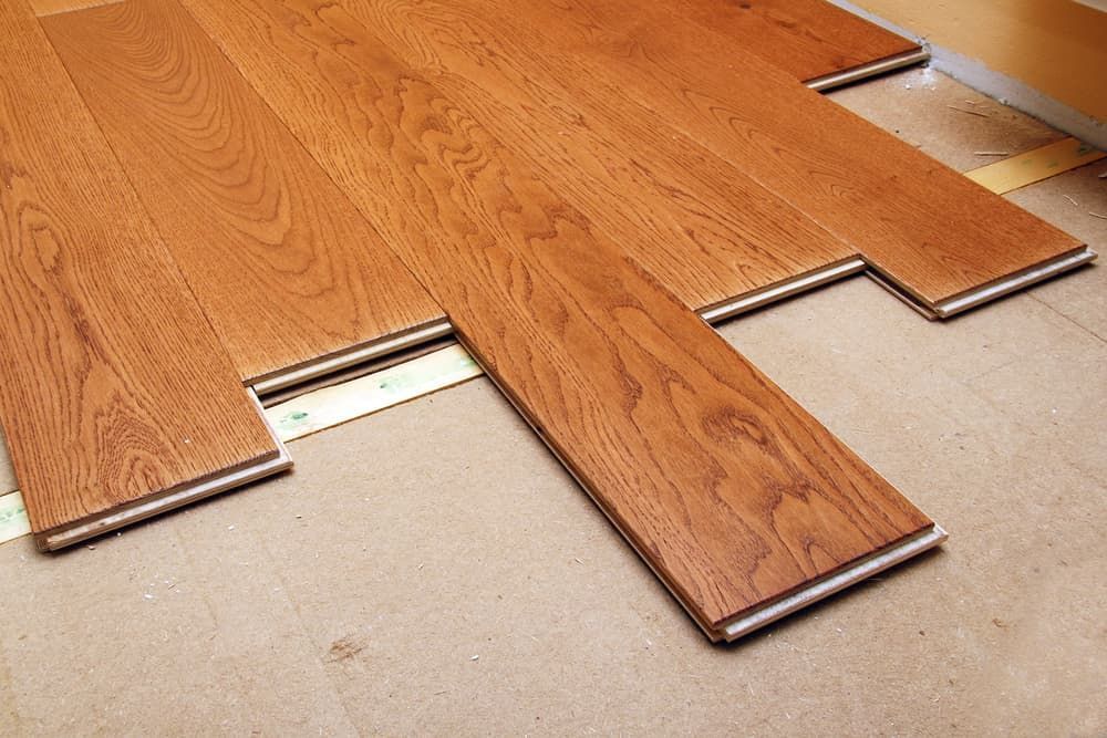 A Wooden Floor Is Being Installed In A Room — Norm Evans Floors Pty Ltd in Beerwah, QLD